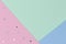 Abstract geometric festive pastel color paper background with glitter stars. Top view