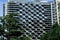 Abstract geometric pattern formed by balconies on a modern high-rise apartment building