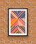 Abstract geometric poster frame on brick wall