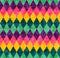 Abstract geometric seamless harlequin pattern from rows of rhombuses in green, yellow, pink and purple