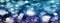 Abstract glitter blue and purple bokeh glow in the dark on black background, banner panoramic horizontal overhead for decorating a