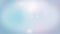 Abstract glittering light blue pastel bokeh particles background.