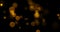 Abstract gold glow particles bokeh flowing effect on black background, holiday happy new year