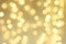 Abstract gold sparkle background, defocused Christmas bokeh.