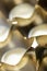 Abstract golden background pattern macro close-up of silver and golden metal surface with shiny reflections and harmonic shapes