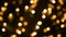 Abstract golden bokeh background, blurred Christmas lights of led garlands