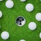 Abstract golf sport background of golf ball and golf hole on green grass background.