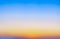 Abstract gradient sunrise in sky with blue and orange natural background