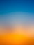 Abstract gradient sunrise in sky with blue and orange natural background