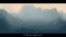 Abstract gray landscape with misty fog till horizon over mountain slopes. Gradient eroded terrain surface. Worlds beyond