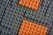 Abstract gray orange background from lego children designer