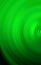 Abstract green background of colorful spin radial motion blur