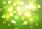 Abstract green blurred vector background with shiny light effects