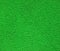 Abstract green color uneven background texture closeup, rugged plastic material,