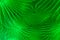 Abstract green lit vivid pattern, photograph created with slow shutter speed and camera rotation