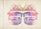 Abstract grunge illustration of butterfly wings for original design. A sheet of old paper stained with violet, purple, red and blu