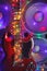 Abstract guitar with festive Christmas lights and music speakers