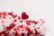 Abstract hearts texture background with focus on one heart. Valentine`s Day red Background. Holiday Backdrop with foil Hearts.
