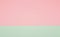 Abstract horizontally divided bi-color retro background, paper texture. Pastel pink and green color