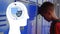 Abstract human head icon against caucasian boy opening his locker at school