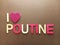 Abstract I love poutine with a heart shape instead of the word love on a brown background