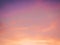 Abstract idyllic winter frosty orange and purple sky. Soft, fluffy and colorful cloud formation. Blur background texture