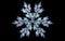 Abstract illustration of a frosty snowflake on a black background