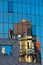 Abstract image as a reflection of old style buildings in a glass of super modern building at downtown of Vienna