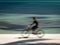 An abstract image of a bicyclist in motion against a blue background. Taken in San Pedro, Ambergris Caye, Belize