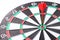 The abstract image of a dartboard laying on the table with darts embroidered, the concept of business, dart board, direction and f