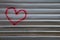 Abstract image of the heart on a metal fence