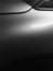 Abstract image of modern car side with smooth shiny surfaces in