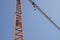abstract image, part of arm machinery construction crane with blue sky background
