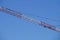 Abstract image, part of arm machinery construction crane with blue sky background