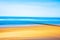 Abstract image of a serene empty beach with golden sand and azure blue water in summer