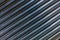 Abstract industrial background of shiny cnc turned rods with flat lay diagonal geometric composition