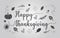 Abstract and isolated black Happy Thanksgiving greeting card with cursive font and scattered leaves and a pumpkin on gray gradient