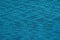 Abstract knitted texture of bright blue color