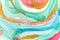 Abstract layers of pink paint on white background. Pink, green, blue and gold round watercolor pattern.