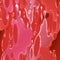 Abstract liquid flows in red color with glossy effect.