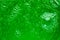 Abstract liquid soap bubbles green background