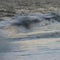 Abstract long exposure landscape image of waves crashing onto groynes on beach during sunset