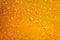 Abstract macro honey bubbles closeup in bright amber color. The texture of the honey. Healthy food concept. Diet