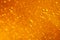 Abstract macro honey bubbles closeup in bright amber color. The texture of the honey. Healthy food concept. Diet