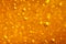 Abstract macro honey bubbles closeup in bright amber color. The texture of the honey. Healthy food concept. Diet