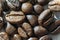 Abstract macro very high detail, high contrast closeup of multiple roasted coffee beans background