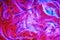 Abstract magenta pink, purple, red, blue cosmetic gel serum background texture