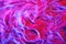 Abstract magenta pink, purple, red, blue cosmetic gel serum background texture