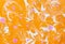 Abstract marbling ebru colorful orange background with waves and pink blots