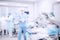 Abstract medical blurred background of operating room, patient lies on table, doctors working